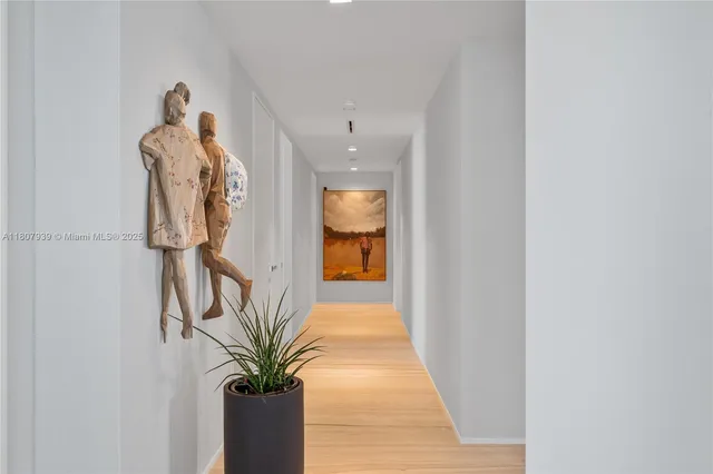 a view of an entryway with wooden floor