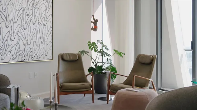 a view of a balcony with couches and wooden floor
