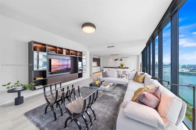 a bedroom with a large bed and a large window