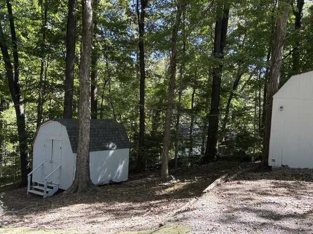 a view of a backyard of the house