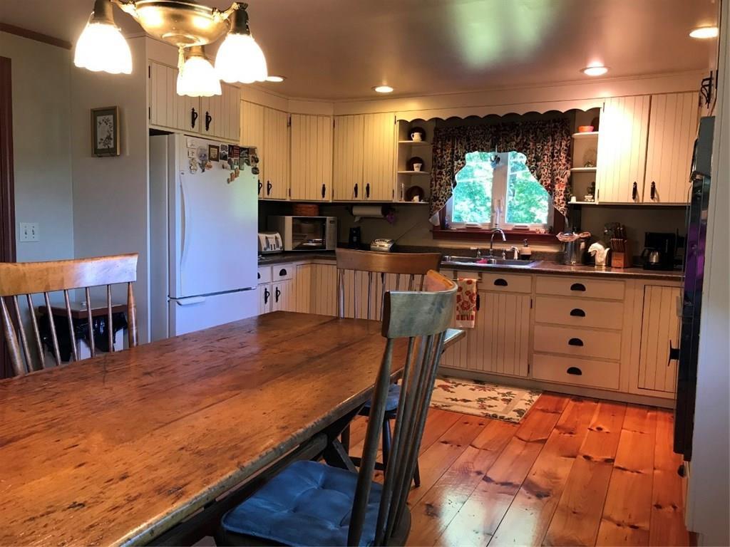 12 Company Road Hollis, ME 04042 - Photo 8 of 33 eat in kitchen that seats 8