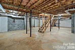 a view of empty room with wooden walls