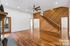 a view of entryway and hall with wooden floor