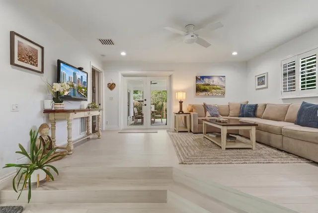 a kitchen with a refrigerator and a sink