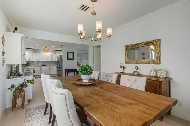 a kitchen with granite countertop a refrigerator stove and microwave