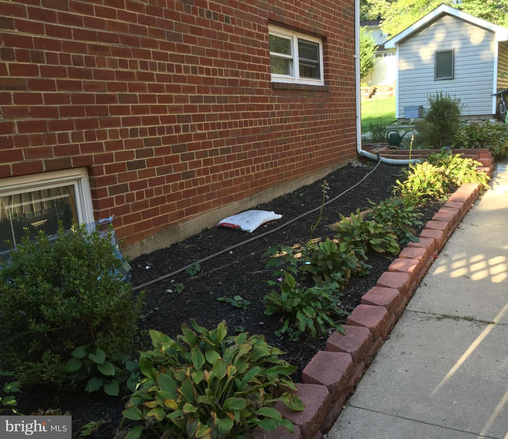 12905 Dean Road Silver Spring, MD 20906 - Photo 3 of 8 a view of a backyard with potted plants
