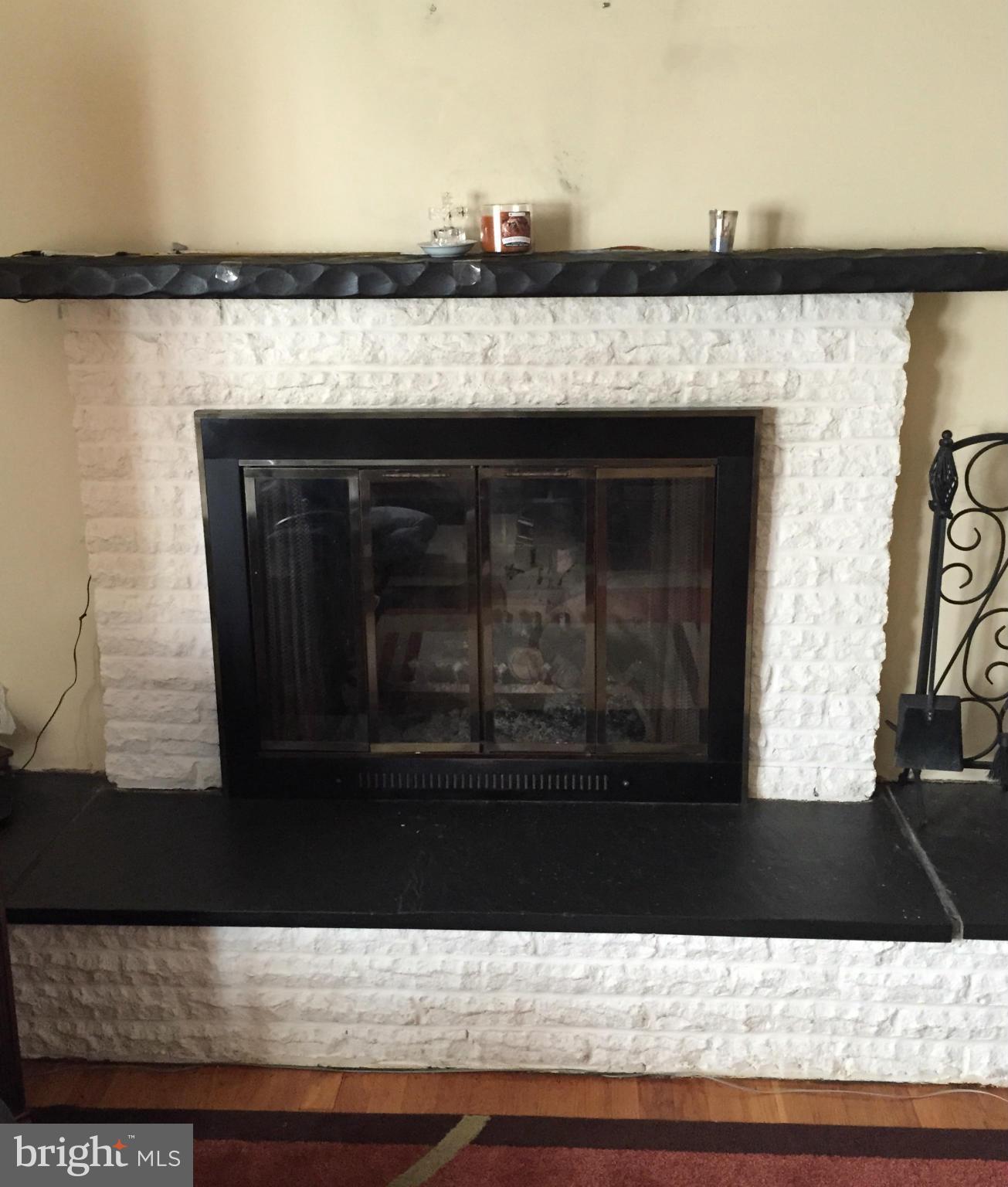 12905 Dean Road Silver Spring, MD 20906 - Photo 6 of 8 a view of a living room with a fireplace