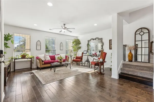 a living room with furniture and kitchen view