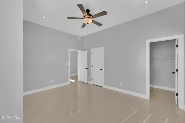 a bathroom with a sink a toilet and shower curtain