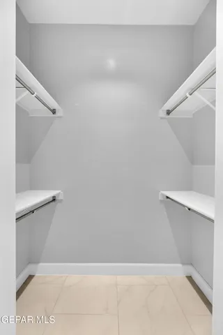 a bathroom with a double vanity sink mirror double and shower