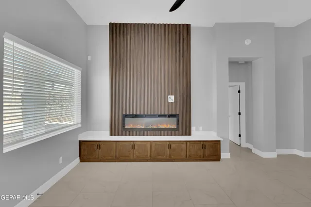 a kitchen with granite countertop a sink stove and cabinets