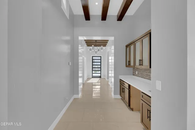 a hallway with washer and dryer