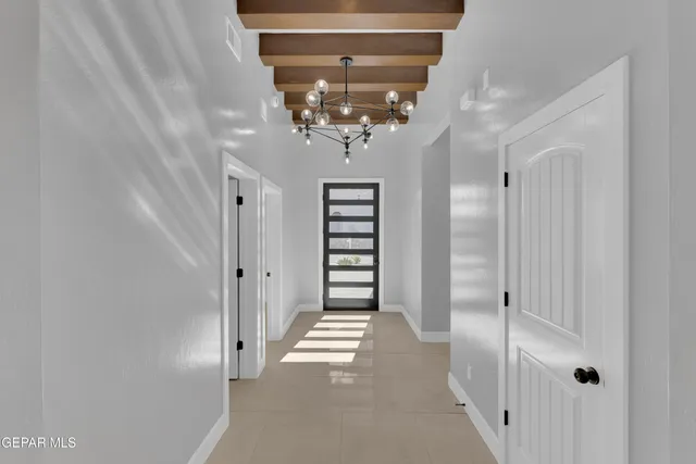 a view of a hallway with a chandelier