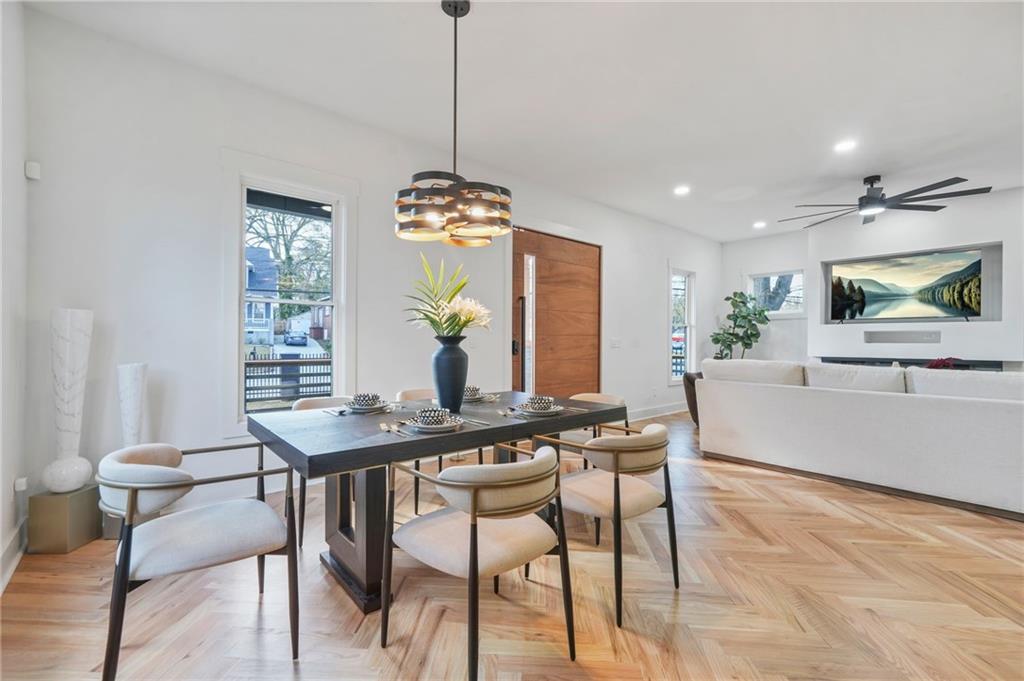 718 Cascade Avenue Southwest Atlanta, GA 30310 - Photo 11 of 37 a view of a dining room and a kitchen with a table chairs
