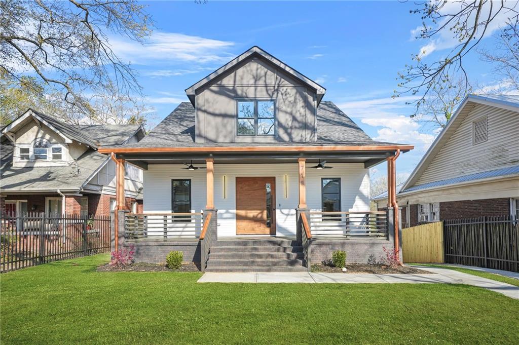 718 Cascade Avenue Southwest Atlanta, GA 30310 - Photo 13 of 37 front view of a house with a yard
