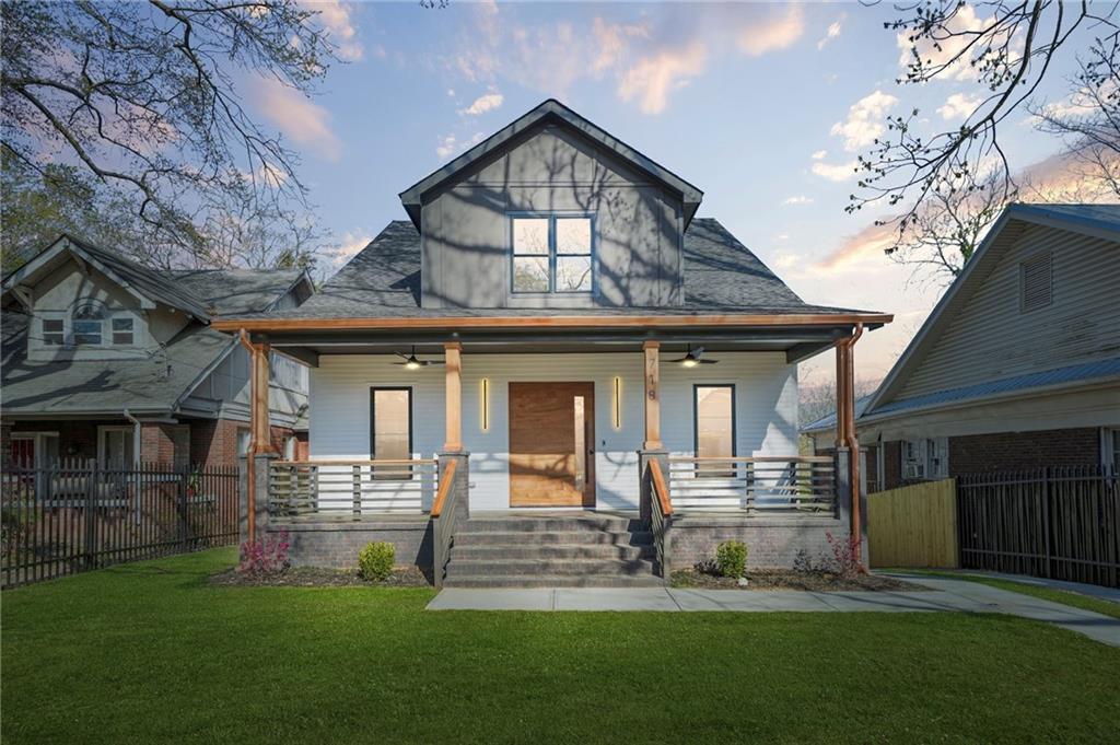 718 Cascade Avenue Southwest Atlanta, GA 30310 - Photo 16 of 37 a front view of a house with a yard