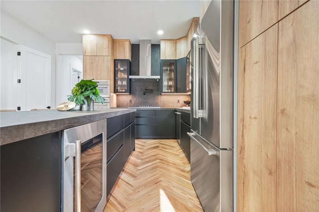 718 Cascade Avenue Southwest Atlanta, GA 30310 - Photo 20 of 37 a kitchen with stainless steel appliances a refrigerator and a sink