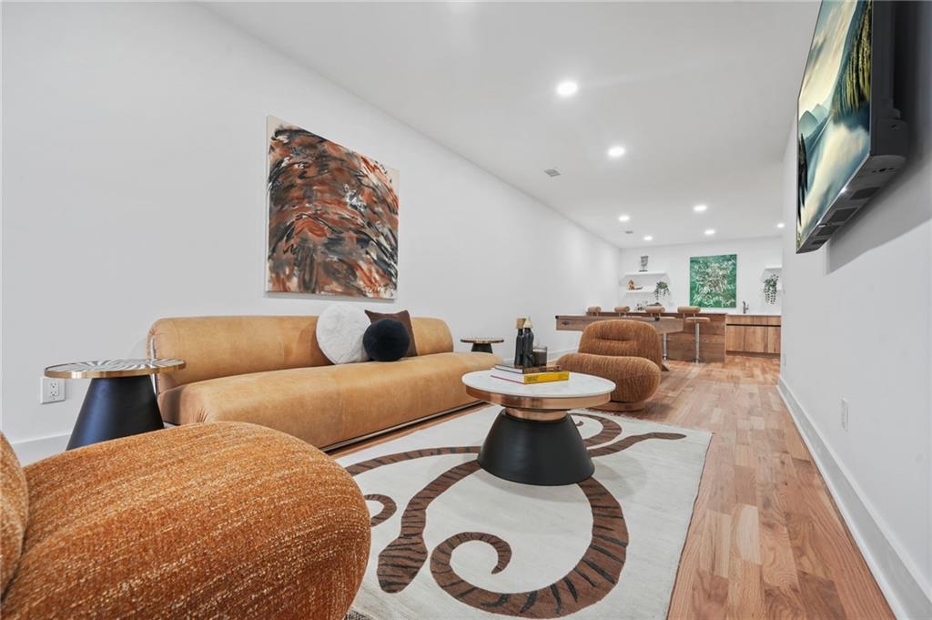 718 Cascade Avenue Southwest Atlanta, GA 30310 - Photo 23 of 37 a living room with furniture and a rug
