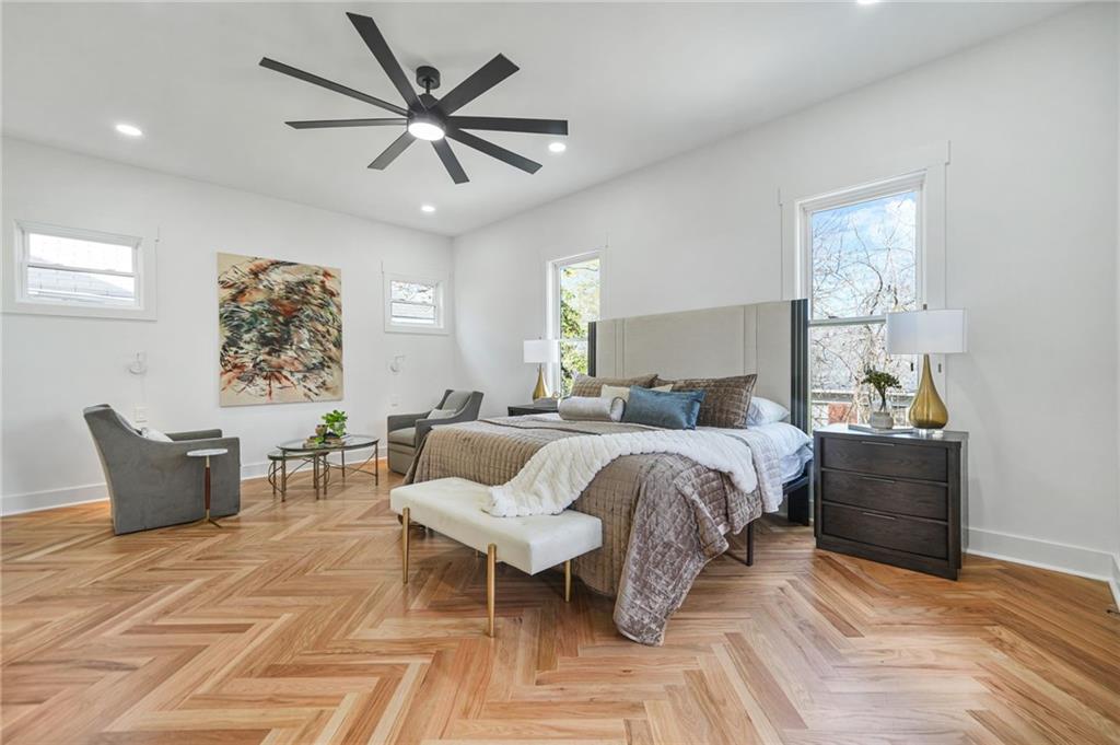 718 Cascade Avenue Southwest Atlanta, GA 30310 - Photo 25 of 37 a bedroom with furniture and a large window