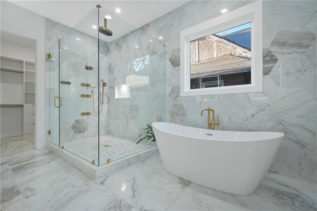 718 Cascade Avenue Southwest Atlanta, GA 30310 - Photo 31 of 37 a bathroom with a bathtub and shower