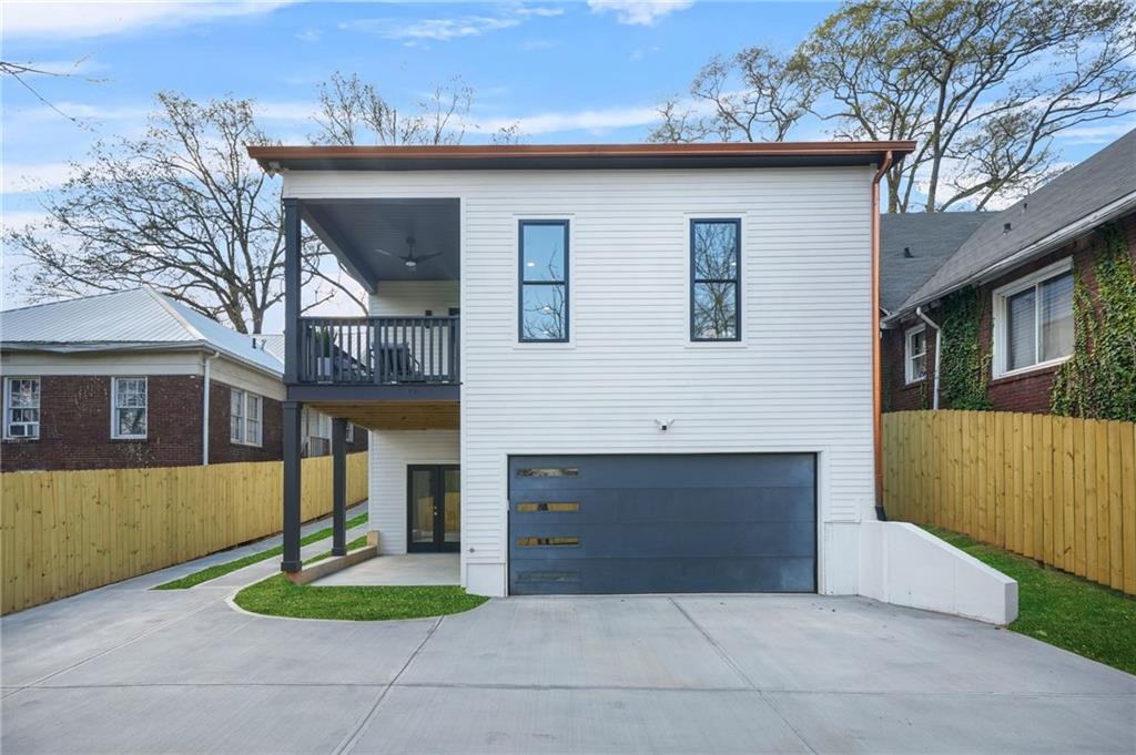 718 Cascade Avenue Southwest Atlanta, GA 30310 - Photo 33 of 37 a front view of a house with a yard and garage