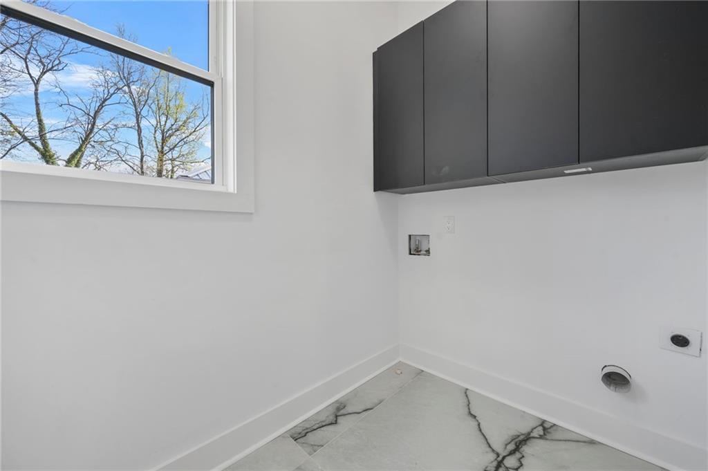 718 Cascade Avenue Southwest Atlanta, GA 30310 - Photo 9 of 37 a view of small space with wooden floor and windows