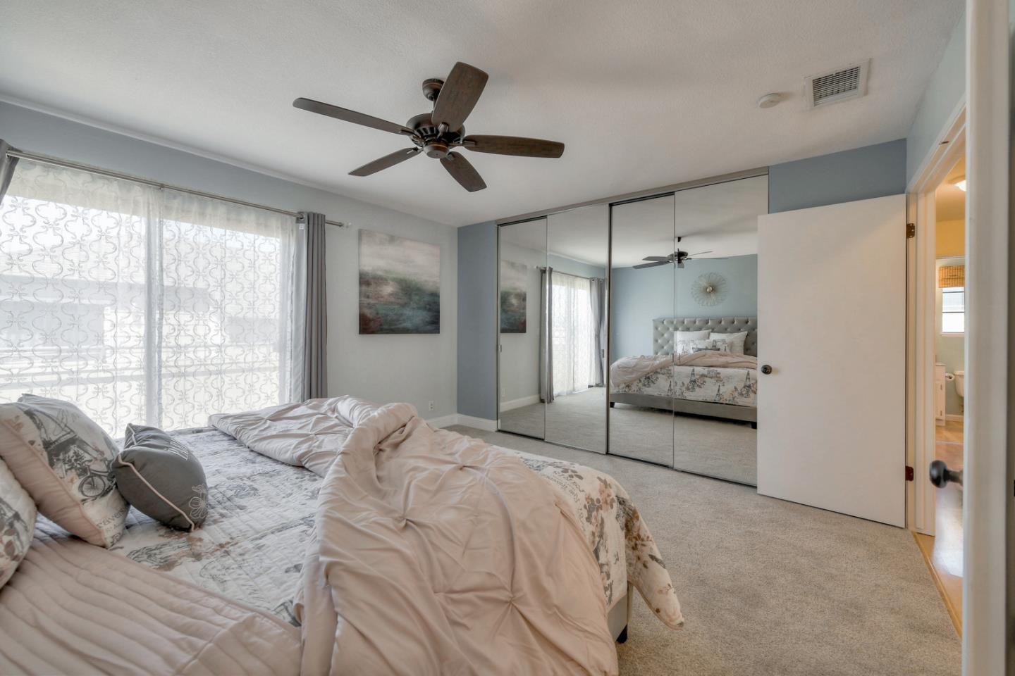 3156 Heather Ridge Drive San Jose, CA 95136 - Photo 19 of 29 a spacious bedroom with a bed and a large window