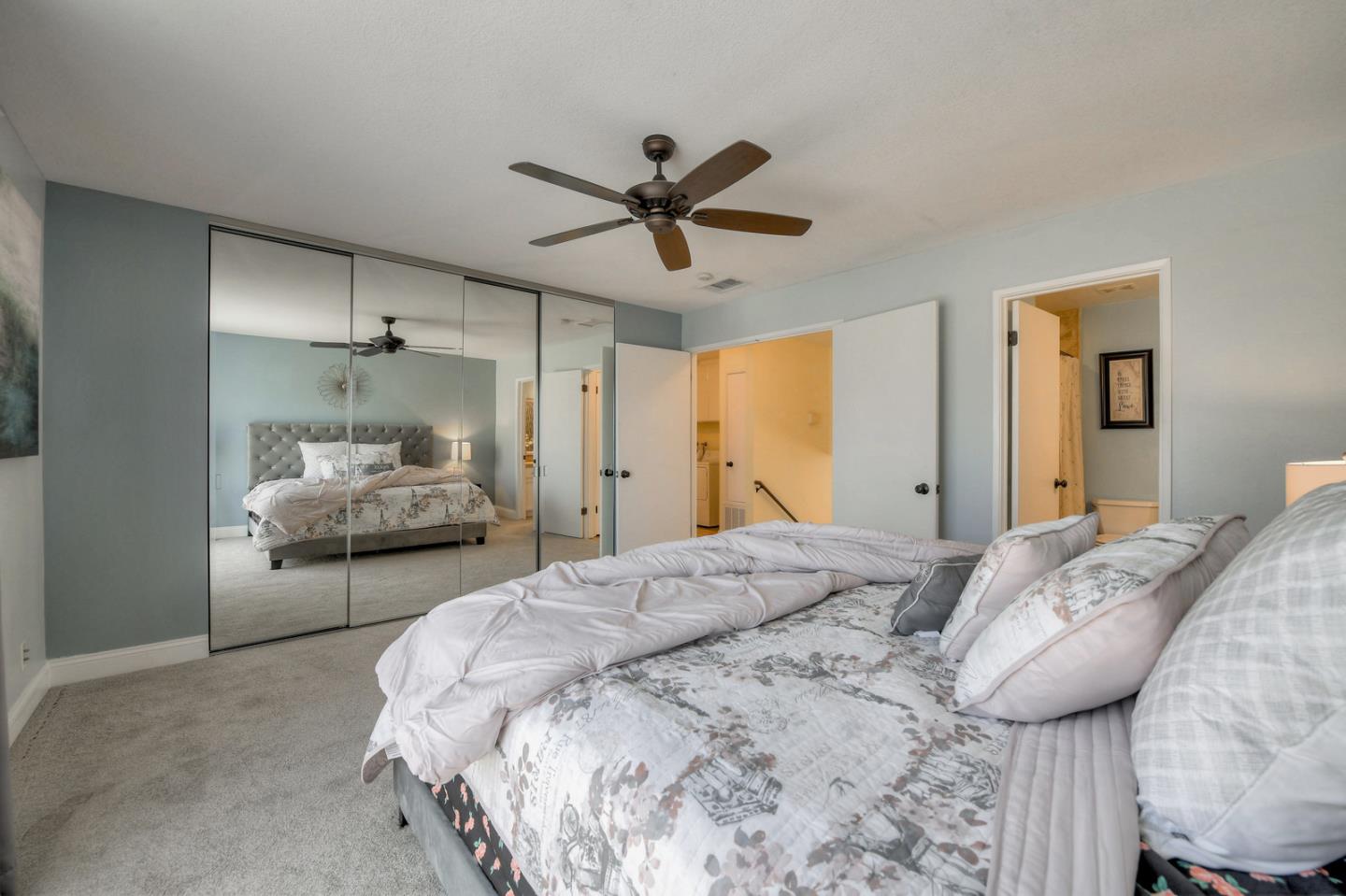 3156 Heather Ridge Drive San Jose, CA 95136 - Photo 21 of 29 a bedroom with a bed and a chandelier