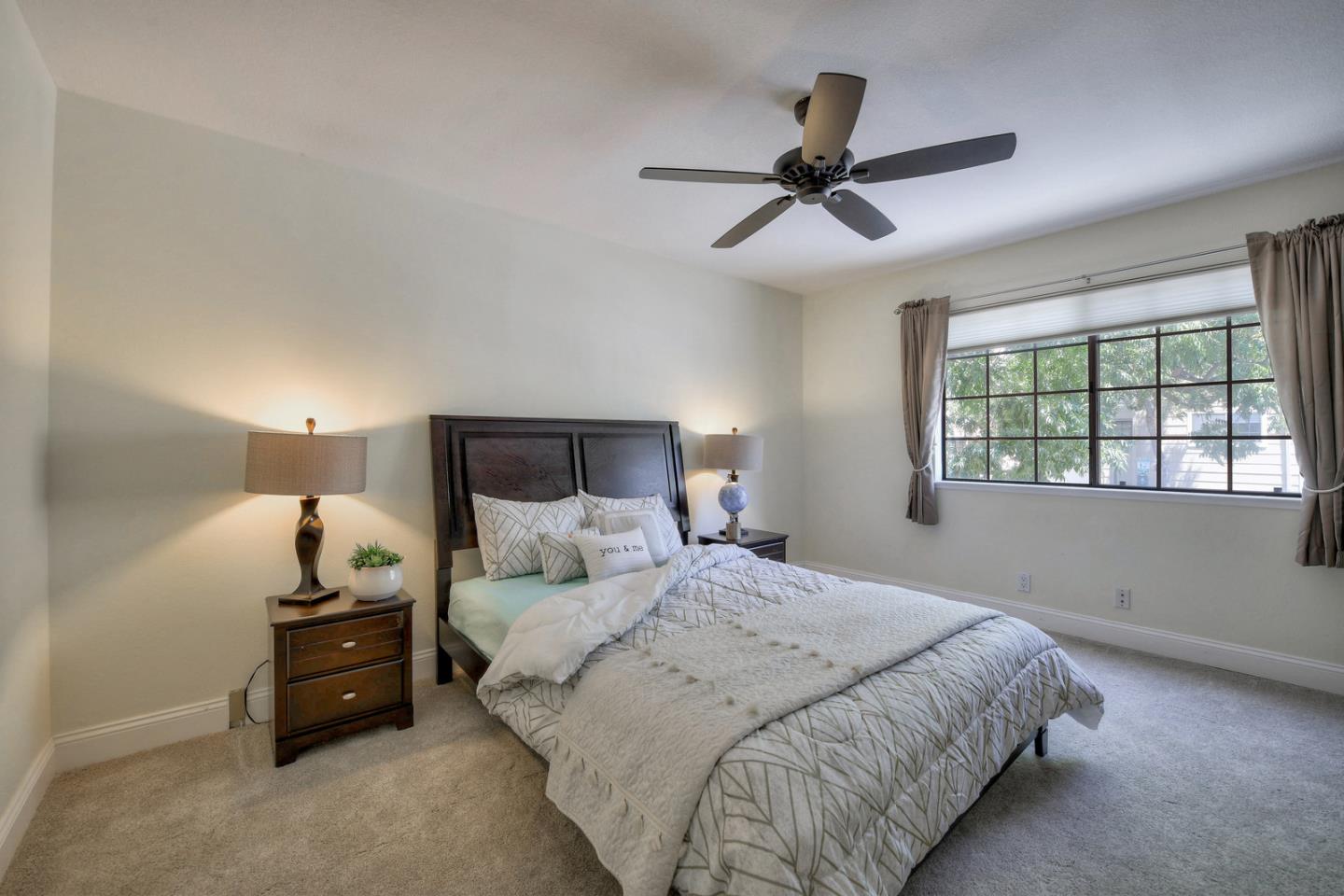 3156 Heather Ridge Drive San Jose, CA 95136 - Photo 23 of 29 a bedroom with a bed and a window