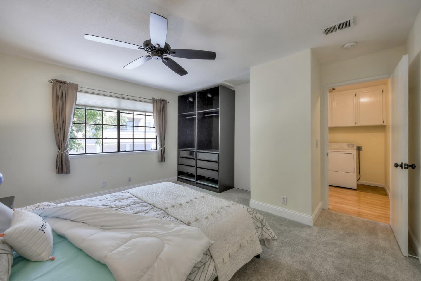 3156 Heather Ridge Drive San Jose, CA 95136 - Photo 24 of 29 a bedroom with a bed and a window