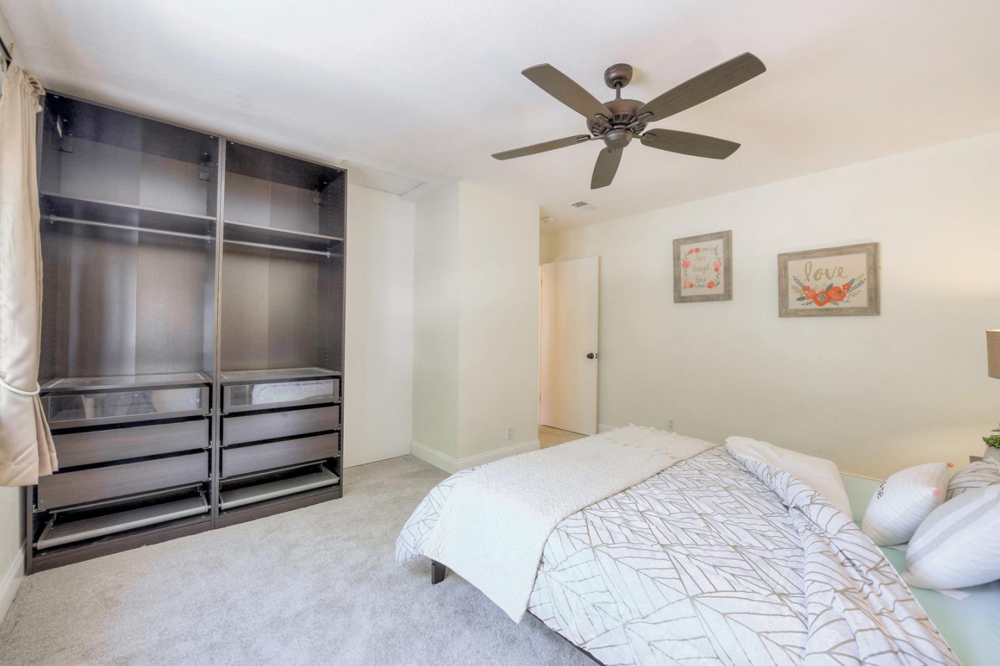 3156 Heather Ridge Drive San Jose, CA 95136 - Photo 25 of 29 a bedroom with a bed and a ceiling fan