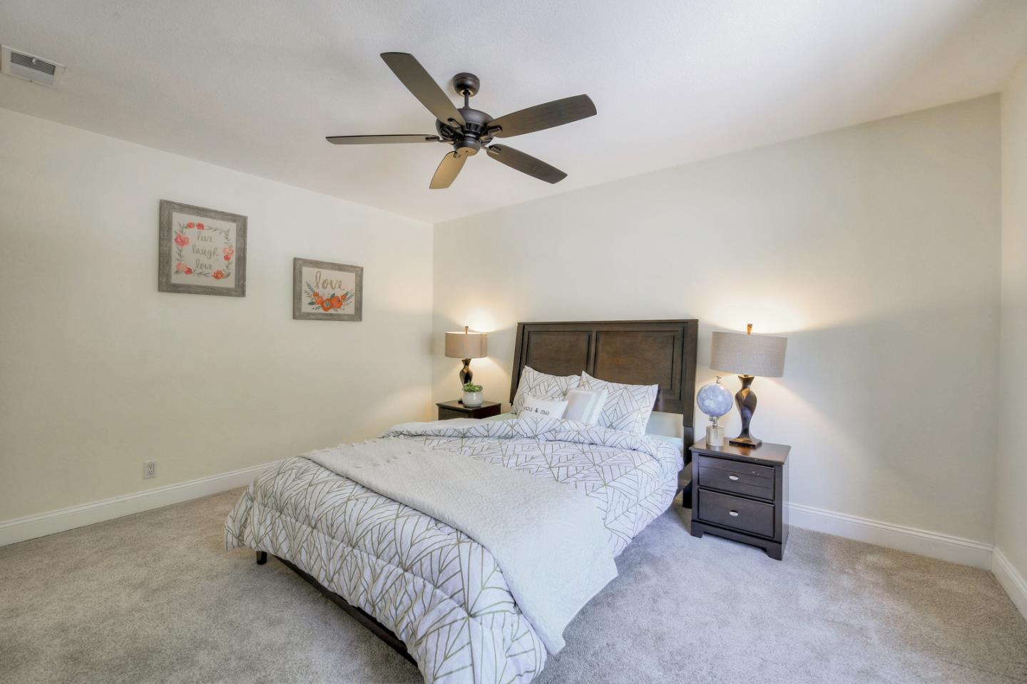 3156 Heather Ridge Drive San Jose, CA 95136 - Photo 26 of 29 a bedroom with a bed and painting on the wall