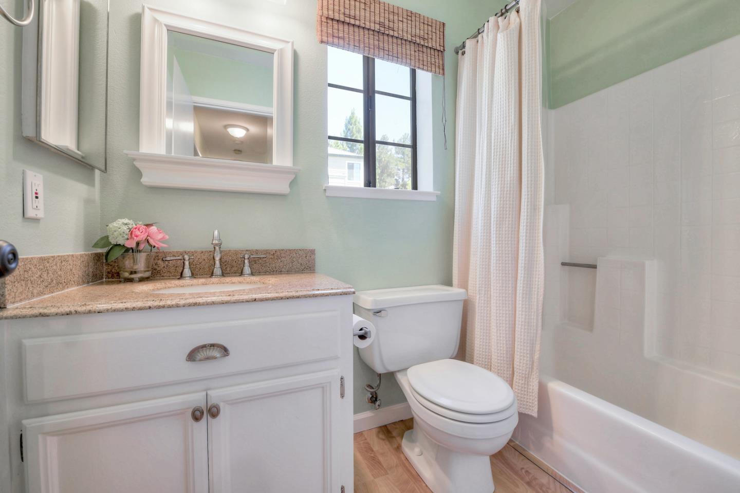3156 Heather Ridge Drive San Jose, CA 95136 - Photo 27 of 29 a bathroom with a sink a toilet and vanity