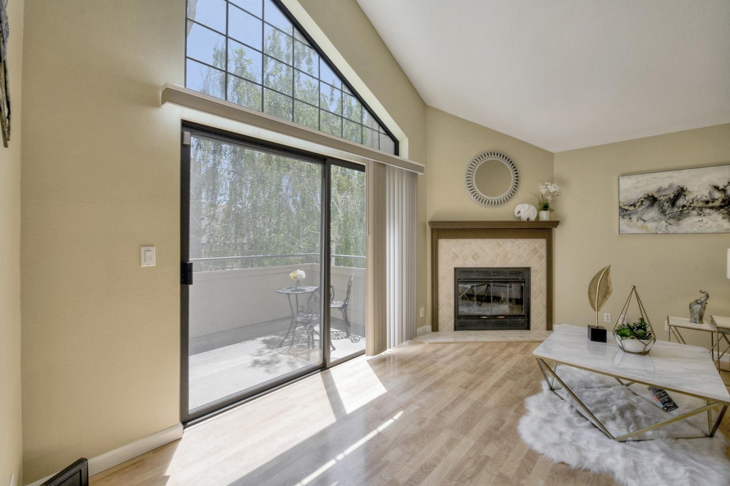 3156 Heather Ridge Drive San Jose, CA 95136 - Photo 7 of 29 a living room with furniture and a fireplace