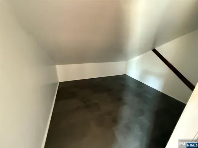 an empty room with wooden floor