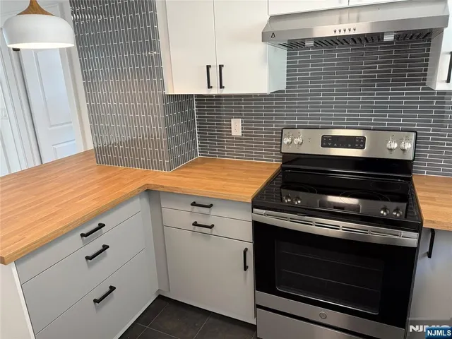 a kitchen with appliances and cabinets