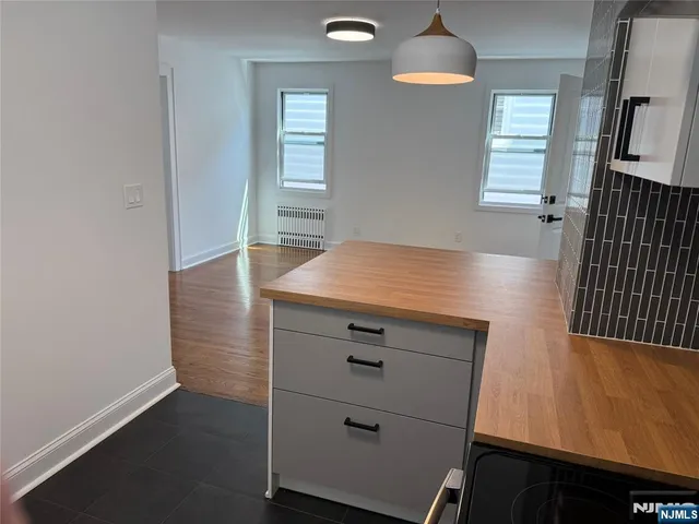 a view of a hallway with windows