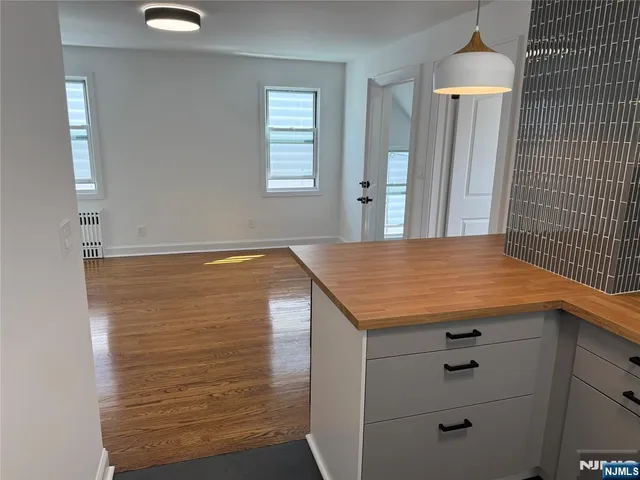a view of kitchen with cabinets