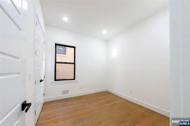 a view of empty room with windows