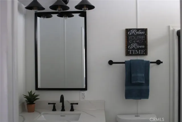 a bathroom with a shower and a mirror