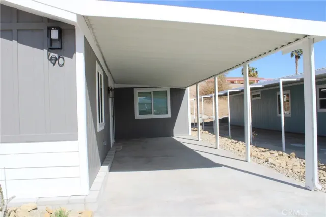 a view of a porch with seating space