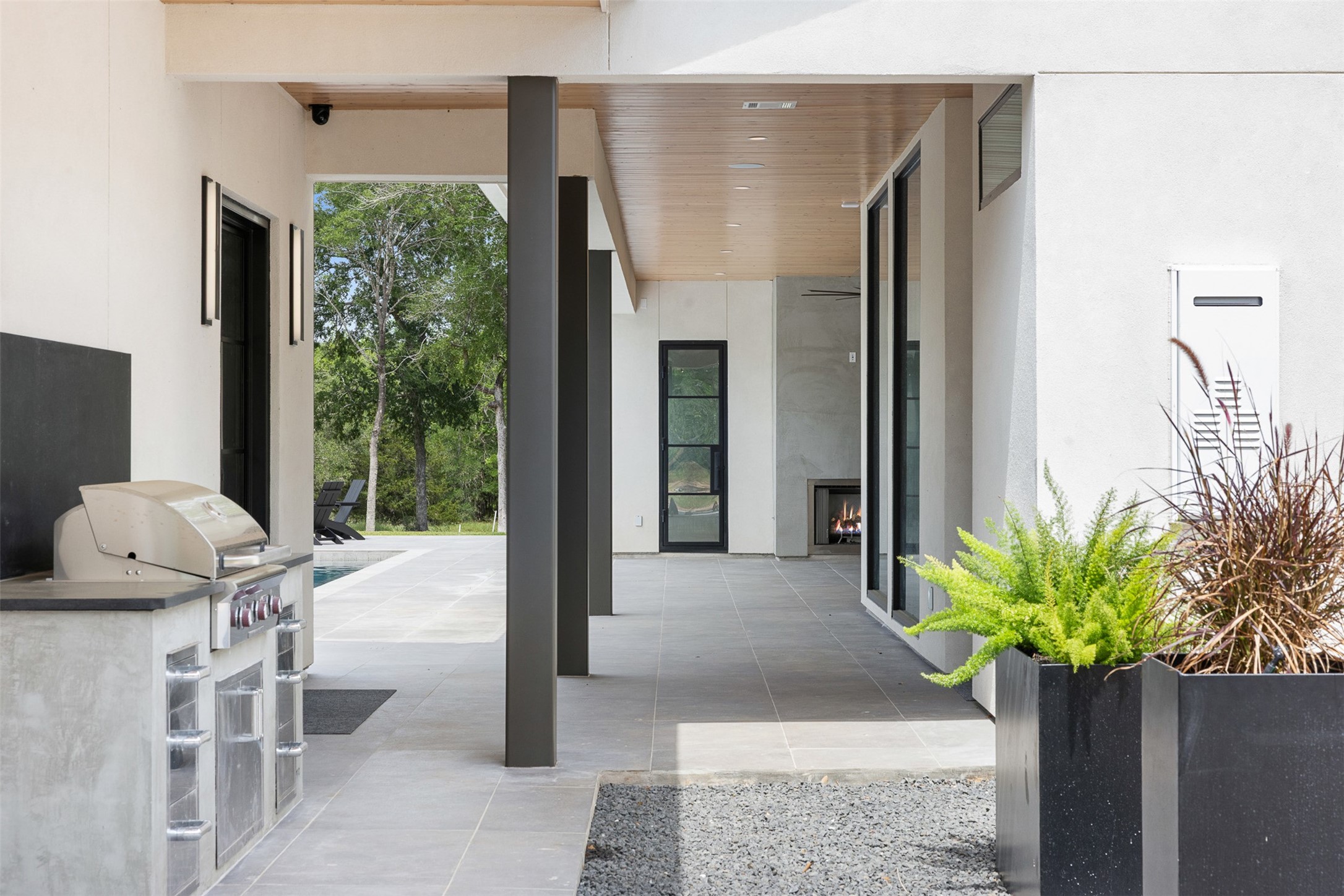 770 South Weyand Road Round Top, TX 78954 - Photo 39 of 50 a view of a porch with chairs and potted plants