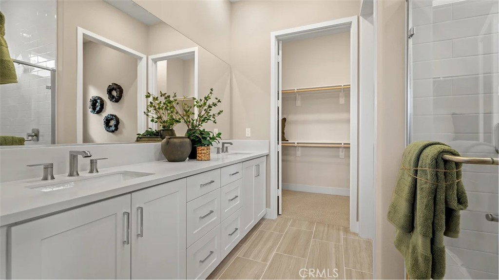 1379 Gavilan Ridge Rancho Mission Viejo, CA 92694 - Photo 11 of 27 a bathroom with a double vanity sink and a mirror