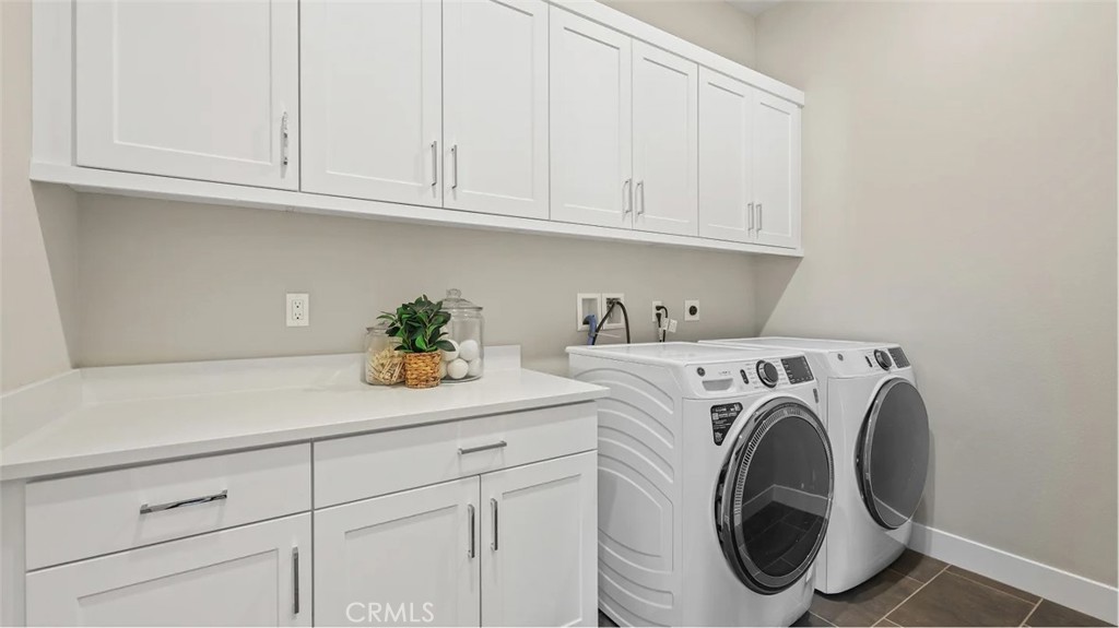 1379 Gavilan Ridge Rancho Mission Viejo, CA 92694 - Photo 17 of 27 a utility room with dryer and washer