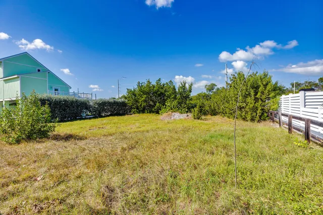 a view of a backyard with sitting area