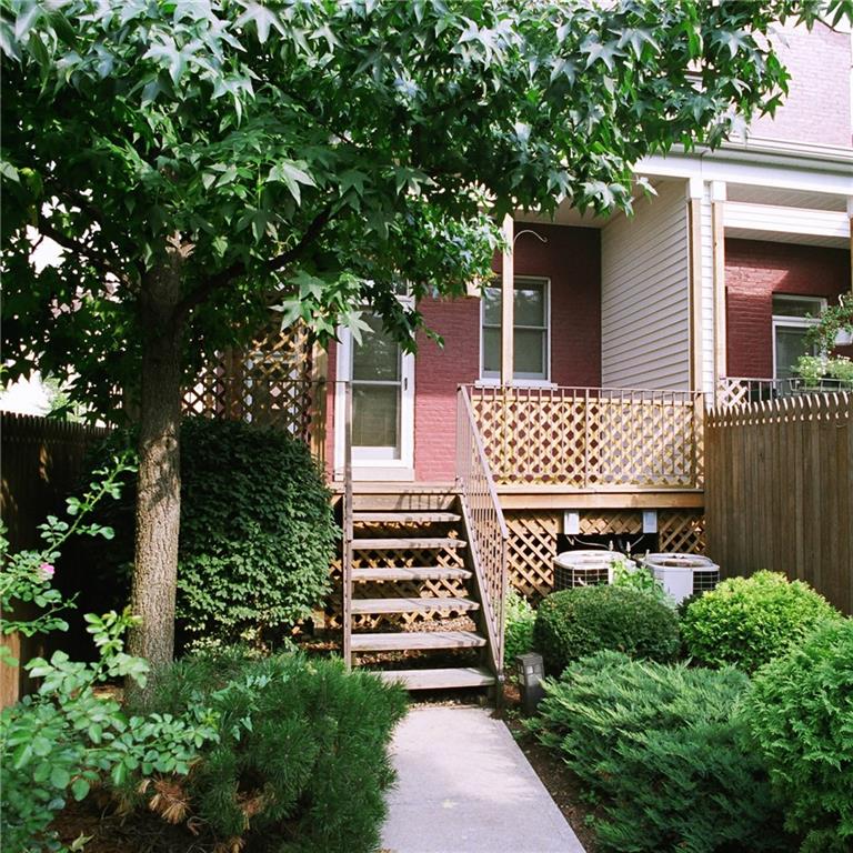 326 Hailman Street Pittsburgh, PA 15206 - Photo 10 of 22 a front view of a house with a garden