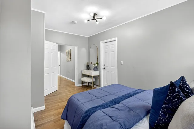 a bedroom with a bed and a table in it