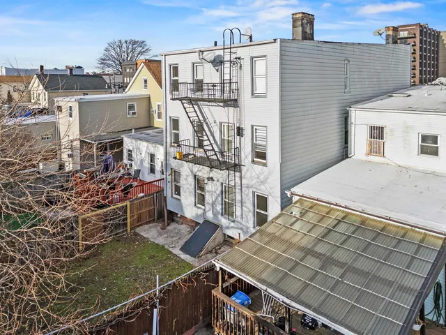 a view of a house with a window and wooden door