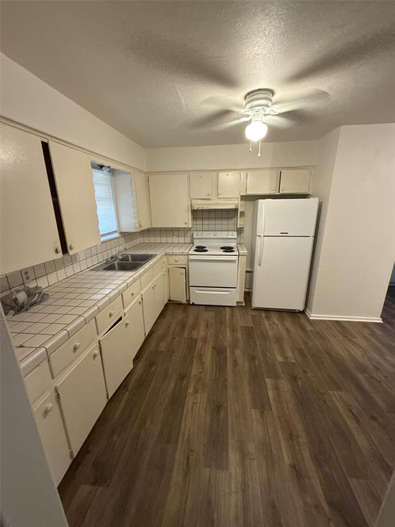 417 Judy Lane Canton, TX 75103 - Photo 5 of 12 a kitchen with a cabinets and wooden floor