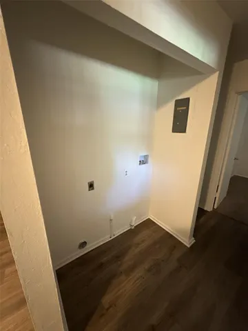 an empty room with wooden floor